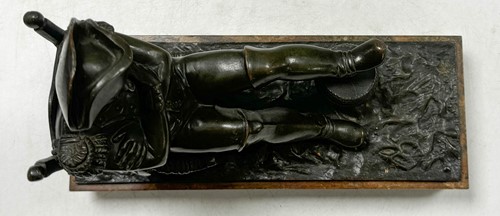 Lot 529 - A bronze model of the recumbent Napoleon resting his foot on a barrel, French School, 19th century