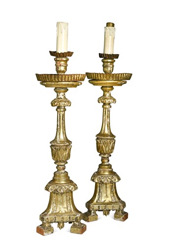 Lot 761 - A pair of Italian carved giltwood candlesticks, 18th century and later