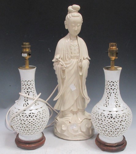 Lot 54 - An Oriental large white glazed pottery...