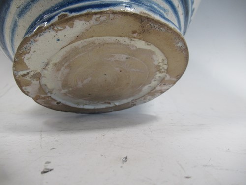 Lot 10 - A blue and white glazed ovoid vase decorated...