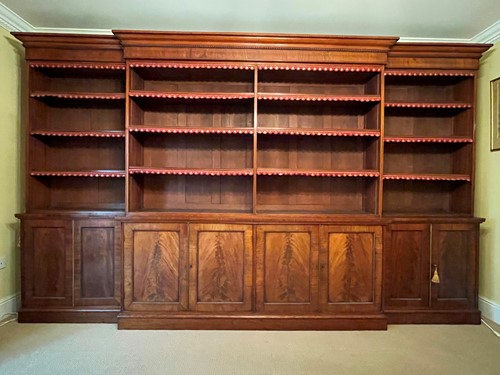 Lot 513 - A mahogany breakfront library bookcase, early 19th century