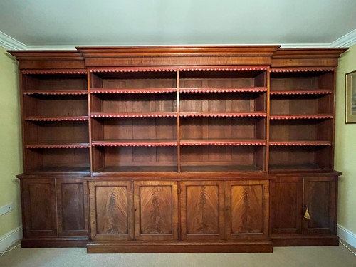Lot 513 - A mahogany breakfront library bookcase, early 19th century