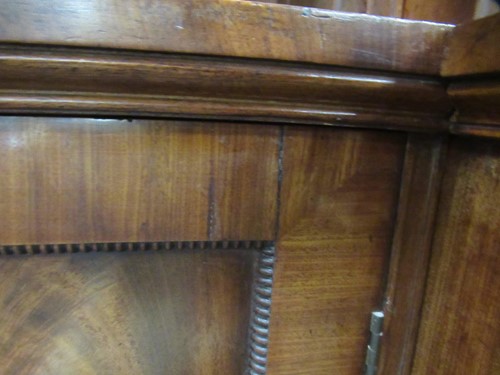 Lot 513 - A mahogany breakfront library bookcase, early 19th century