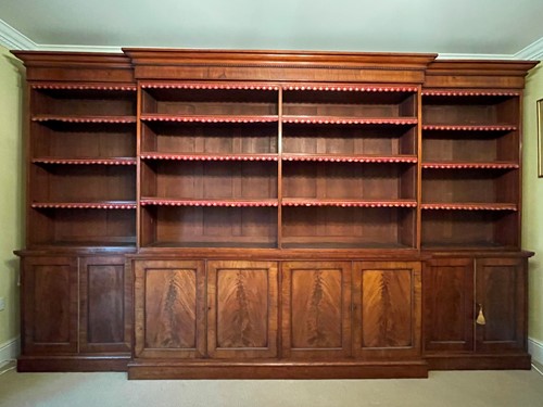 Lot 513 - A mahogany breakfront library bookcase, early 19th century