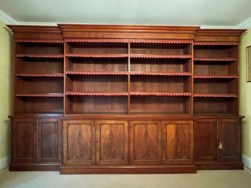 Lot 513 - A mahogany breakfront library bookcase, early 19th century