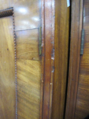 Lot 513 - A mahogany breakfront library bookcase, early 19th century