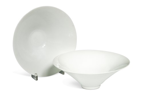 Lot 2 - A pair of Chinese white glazed "hidden decoration" floral bowls, 18th century