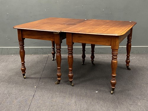 Lot 432 - A 19th century mahogany dining table in two...