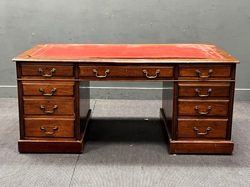 Lot 416 - An Edwardian mahogany pedestal desk with nine...