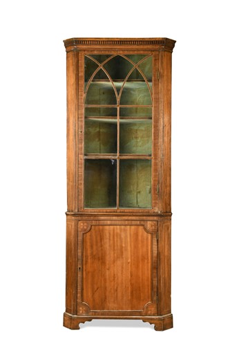 Lot 476 - A George III mahogany floor standing corner cupboard