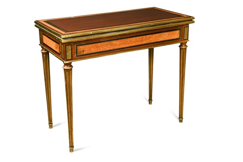 Lot 565 - A gilt brass mounted fruitwood veneered card table, early 19th century