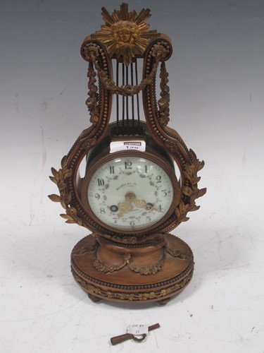 Lot 136 - A late 19th century French gilt metal lyre...