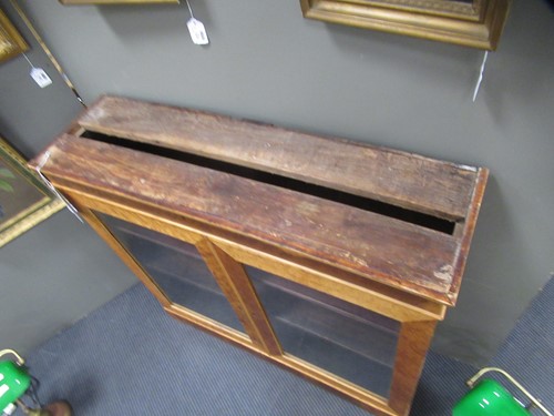 Lot 507 - A pair of Victorian birdseye maple bookcases with marble tops