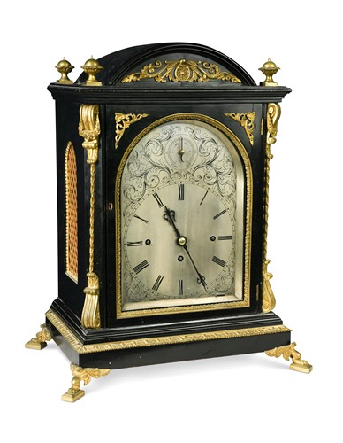 Lot 364 - A Victorian ebonised and gilt metal mounted three train table clock with wall bracket