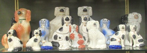 Lot 218 - A collection of Staffordshire spaniels, the...