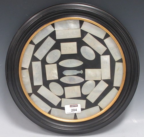 Lot 204 - A framed and glazed collection of...