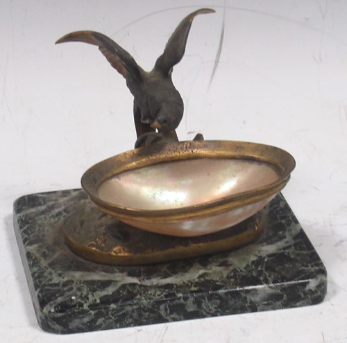 Lot 169 - A bronze sweetmeat dish with gilded bird with...