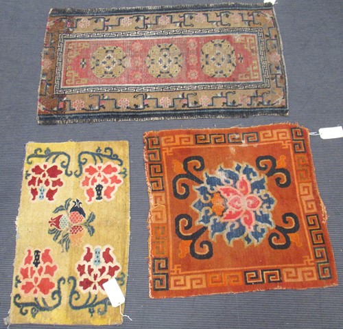 Lot 871 - A Tibetan wool rug, 20th century, the dark...