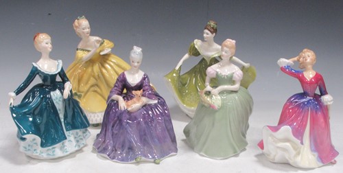 Lot 63 - Six Royal Doulton female figures, to include...