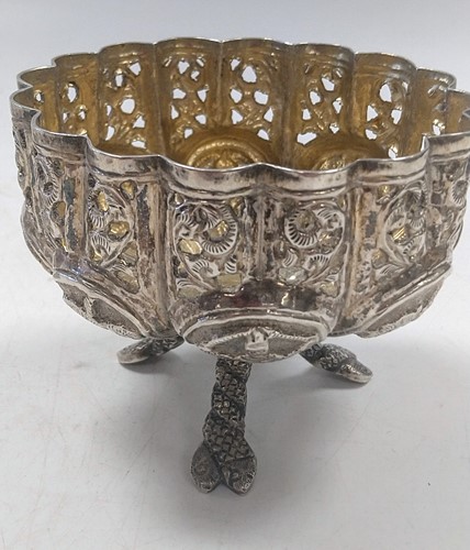 Lot 345 - A Middle Eastern metalwares circular lidded...
