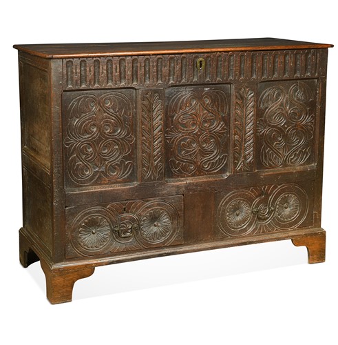 Lot 523 - An carved oak mule chest, incorporating 17th century elements