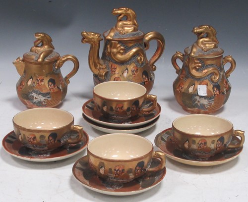 Lot 60 - A Satsuma tea set, comprising tea pot, milk...
