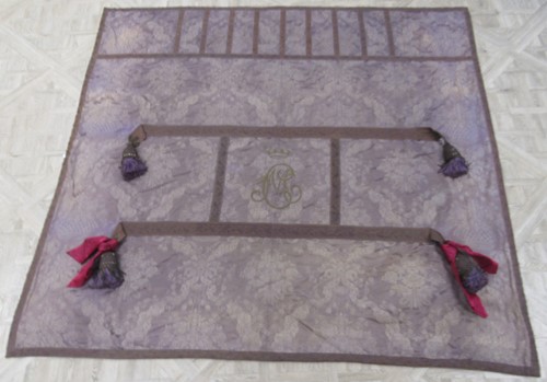 Lot 266 - A 19th century embroidered purple silk damask...