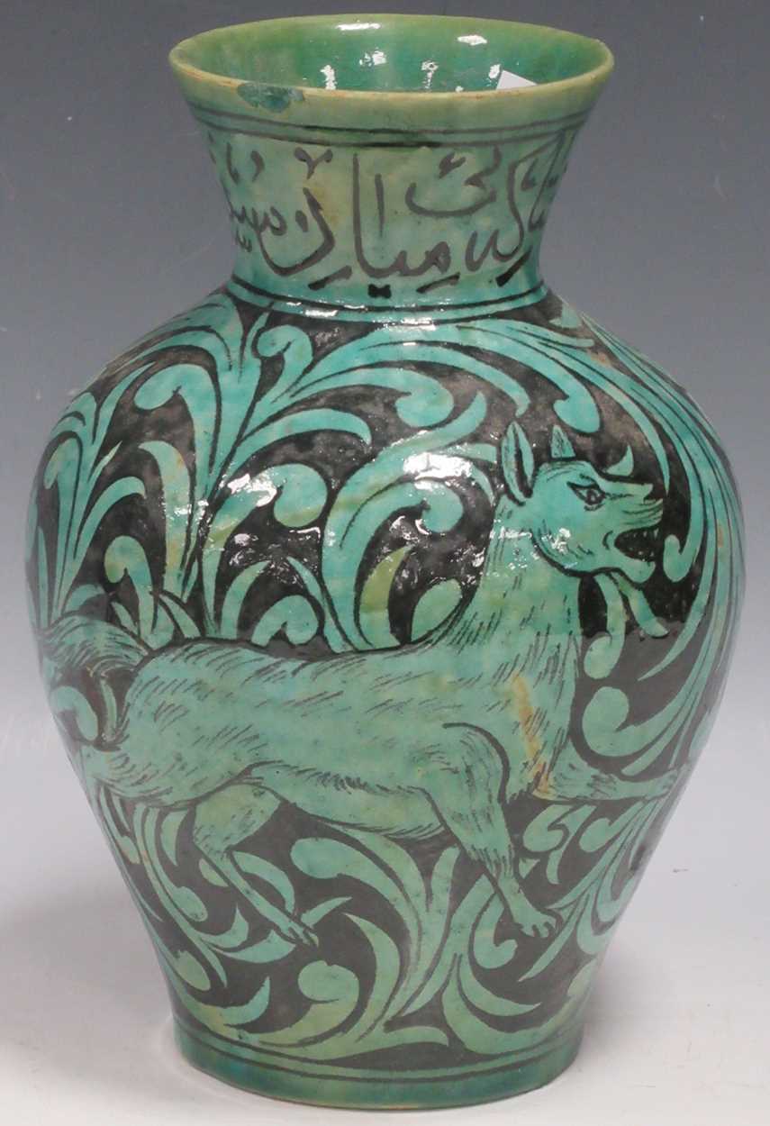 Lot 5 - A Qajar vase of ovoid form, the turquoise...