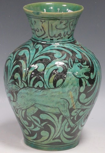 Lot 5 - A Qajar vase of ovoid form, the turquoise...