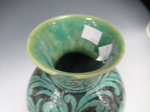 Lot 5 - A Qajar vase of ovoid form, the turquoise...