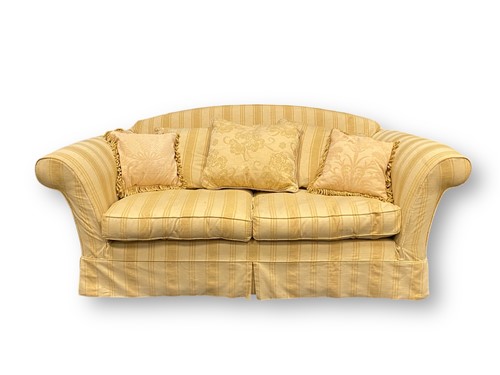 Lot 704 - A modern two seater sofa upholstered in a...
