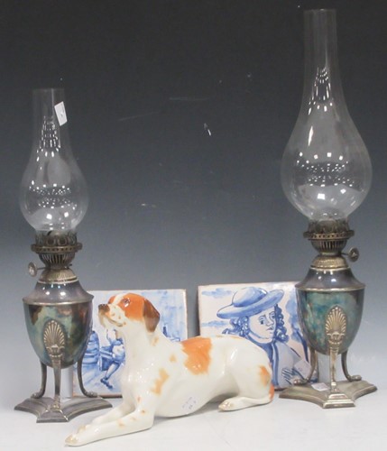 Lot 10 - A pair of vase shaped silver plated oil lamps...