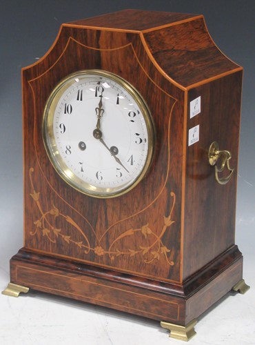 Lot 150 - An Edwardian rosewood and inlaid mantle clock,...