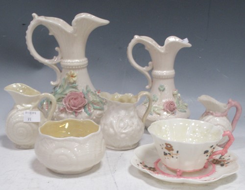 Lot 143 - Five Belleek pitchers of various sizes, a...