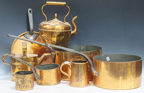 Lot 241 - A collection of copperwares: graduated copper...