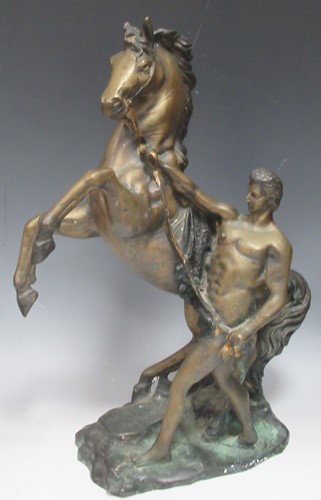 Lot 199 - A bronze horse and rider equestrian group...