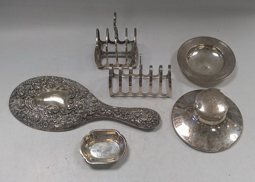 Lot 352 - A collection of silverware including toast...
