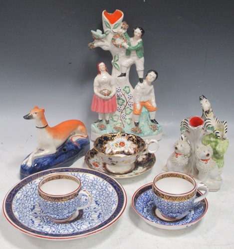 Lot 111 - A Staffordshire figural spill vase of children...