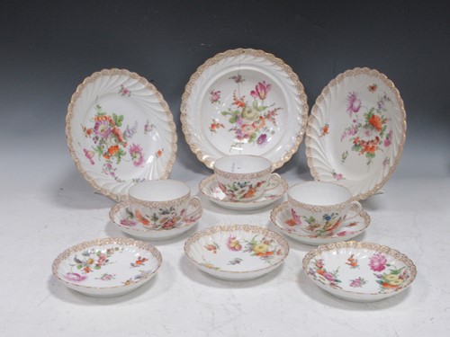 Lot 113 - A Dresden part tea service decorated with...