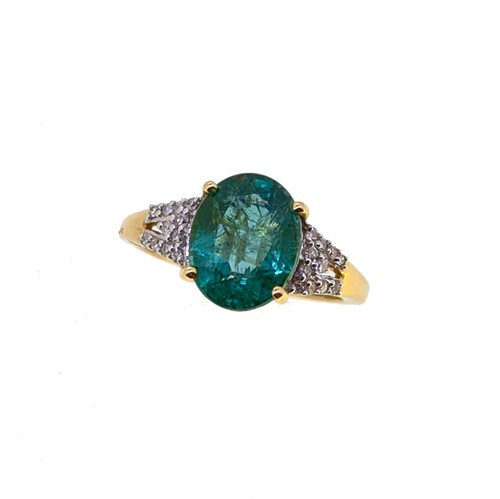 Lot 83 - An 18ct gold emerald and diamond ring