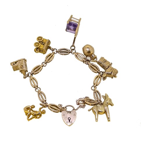 Lot 102 - A charm bracelet