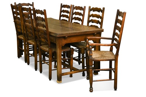Lot 393 - A set of twelve oak wavy-ladder back dining chairs, 18th century style