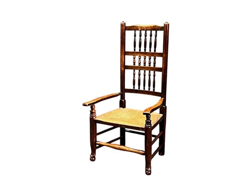 Lot 490 - A 19th century spindle back armchair with rush...