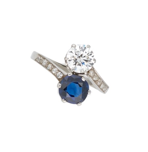Lot 178 - A mid 20th century sapphire and diamond crossover ring