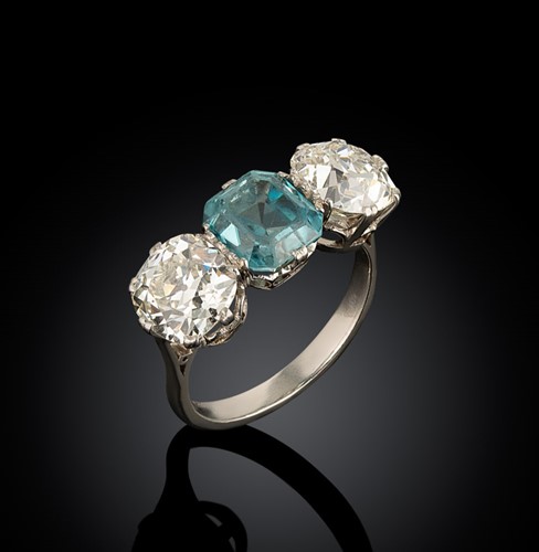 Lot 202 - A zircon and diamond three stone ring