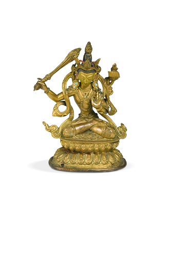 Lot 53 - A Tibetan gilt copper figure of the Bodhisattva Manjusri, 18th century