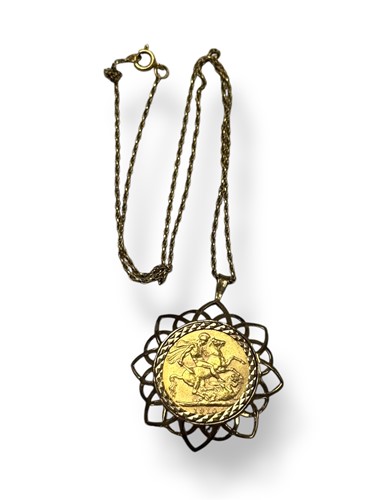 Lot 270 - A full sovereign within a hallmarked 9ct gold...