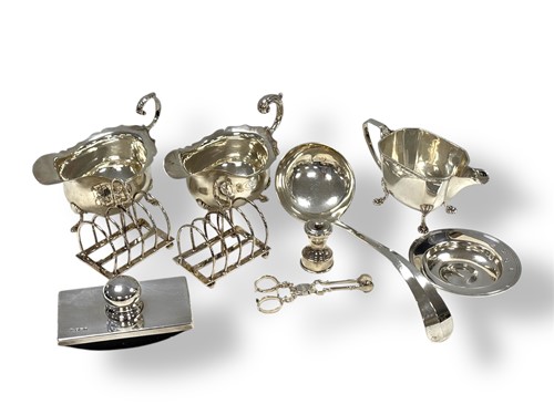 Lot 238 - A collection of silverware including sauce...