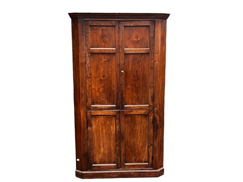 Lot 484 - A large George III style elm floorstanding...