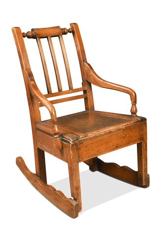 Lot 526 - A fruitwood rocking armchair, North West, 19th century